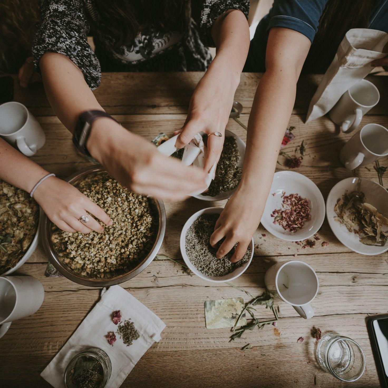 Community members collaborating in a contemporary kitchen, swapping recipes and techniques